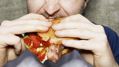 Man eating burger