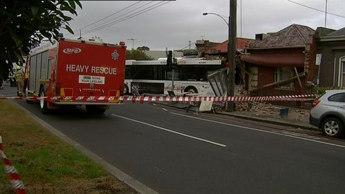 The bus driver was taken to hospital with minor injuries. (9NEWS)