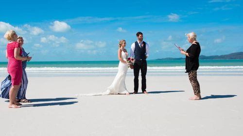 Alyssia and Curtis Fisher eloped on Whitehaven beach to have a post Cyclone wedding. (Photo: Tropix Photography)