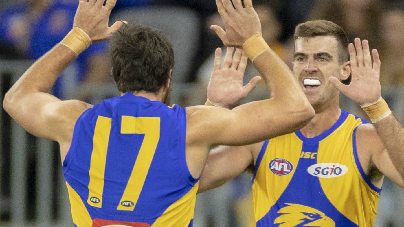 Josh Kennedy and Scott Lycett of the Eagles celebrate a goal during the Round 4 AFL match between the West Coast Eagles and the Gold Coast Suns at Optus Stadium in Perth, Saturday, April 14, 2018. 
