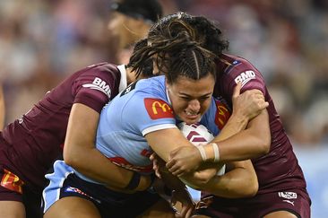 TOWNSVILLE, AUSTRALIA - JUNE 22: Millie Boyle of the Blues is tackled during game two of the women&#x27;s state of origin series between New South Wales Skyblues and Queensland Maroons at Queensland Country Bank Stadium on June 22, 2023 in Townsville, Australia. (Photo by Ian Hitchcock/Getty Images)