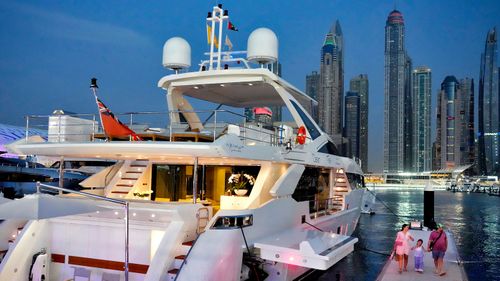 A large yacht is docked in Dubai's marina precinct, an area of high rise buildings overlooking the ocean which is popular with foreigners.