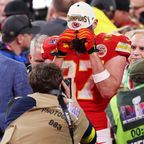 Travis Kelce pulls down his hat in an emotional reaction to the Chiefs&#x27; Super Bowl victory.