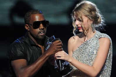 Kanye West jumps onstage as Taylor Swift accepts her award for the "Best Female Video" award during the 2009 MTV Video Music Awards at Radio City Music Hall on September 13, 2009 in New York City. 