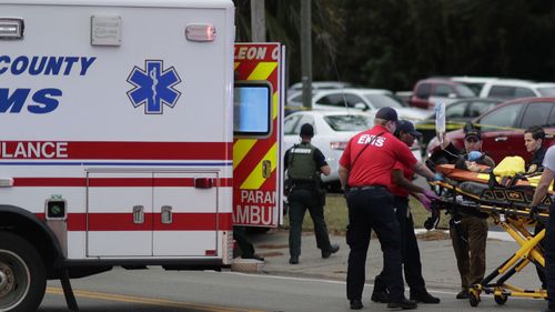 Emergency services at the scene of the shooting at the Hot Yoga studio in Florida.