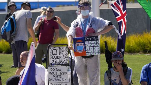 Protesters marched in Melbourne to also demand  COVID-19 mandates be stopped. 