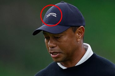 Tiger Woods red circle around his Sun Day Red logo.