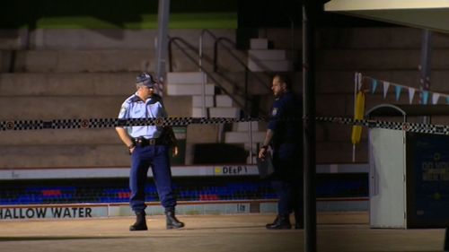 Police set up a crime scene at the pool. (9NEWS)