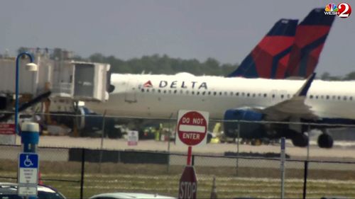 Emergency vehicles are seen on the tarmac at Orlando International Airport.