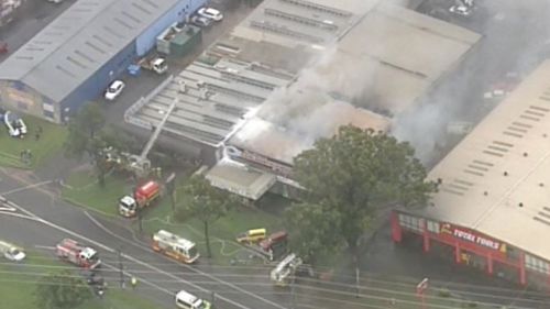 Firefighters battle factory fire on Coreen Avenue in Penrith, in Sydney's west