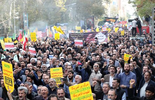 The people of Iran marched through the streets of the capital yesterday chanting "death to America" and celebrating the  anniversary of the 1979 US Embassy takeover. 