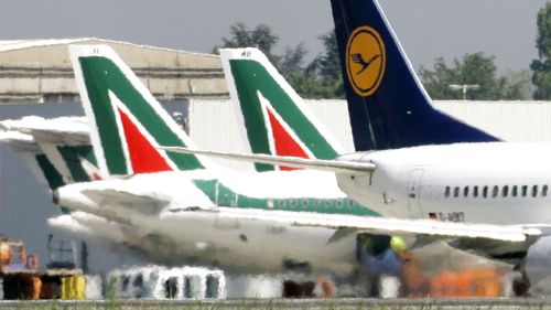 Lufthansa and Alitalia jetliners are parked at the Milan Linate airport, Italy.