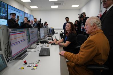 King Charles III is shown the control room during a visit to Luton DART Parkway Station 