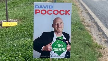 ACT Senate hopeful David Pocock wants Advance Australia prosecuted for signs depicting him as a Greens candidate.