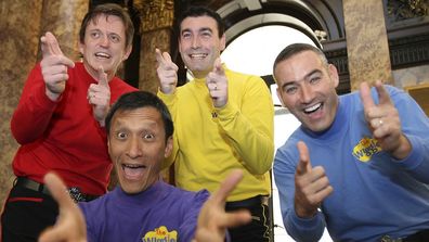 FILE - In this June 28, 2006 file photo, Australian children's entertainers The Wiggles, Murray Cook (Red Wiggle), Greg Page (Yellow Wiggle), Jeff Fatt (Purple Wiggle), and Anthony Field (Blue Wiggle) make a special appearance at the Australian High Commission in London at the start of their UK tour. Page, one of the original members of the popular Australian children's band has been hospitalized after collapsing during a wildfire relief concert.  Page fell as he left a stage in New South Wales 