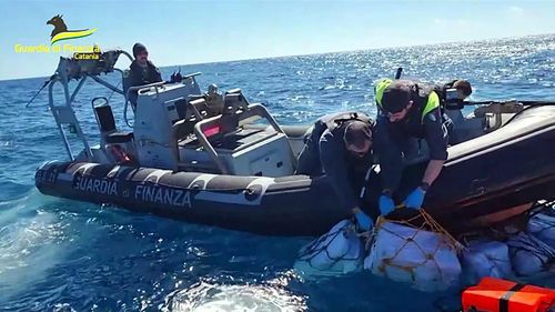 Italy's Financial Police, Guardia di Finanza, recovered a record amount of cocaine during a routine surveillance flight off the eastern coast of Sicily on Sunday.