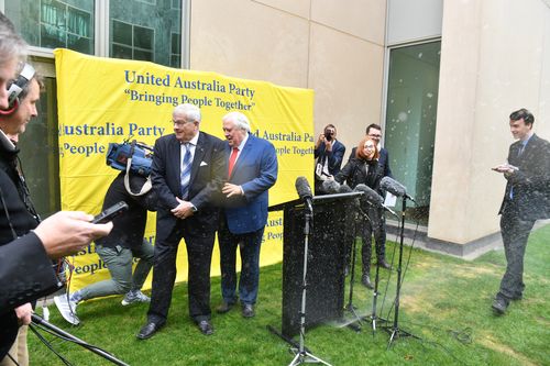 Clive Palmer's press conference was a train wreck from the start, cut short by the Senate sprinklers. Picture: AAP