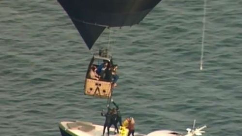 A coast guard rescue boat rescued passengers while the balloon hovered above. (Supplied)