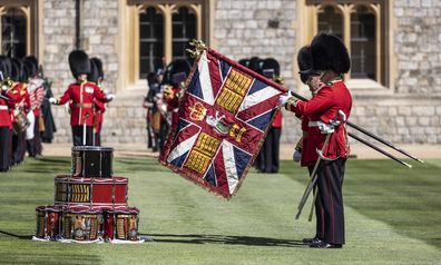 The new regimental colours of the 1st battalion Irish guards is paraded in the Quadrangle of Windsor Castle where they were presented to the regiment by Prince William, The Duke of Cambridge.  