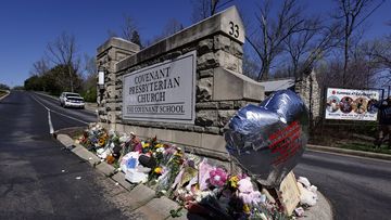 A balloon with names of the victims is seen at a memorial at the entrance to The Covenant School on Wednesday, March 29, 2023, in Nashville, Tenn. (AP Photo/Wade Payne)