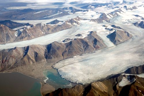 In this view from a passenger plane, glaciers melt during a summer heat wave in the Svalbard Archipelago on July 28, 2020, near Longyearbyen, Norway.