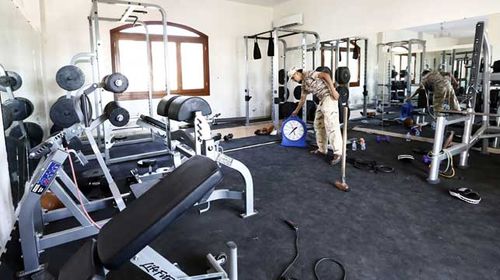 A member of the Fajr Libya (Libya Dawn) Islamist militia stands at the gym of a villa at the US diplomatic compound in the Libyan capital Tripoli. (Getty/AFP)