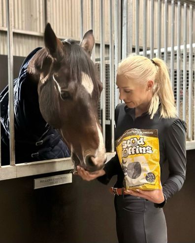 Kylie Christian feeds her horse Bellaire Cannavaro - affectionately known as Oscar.