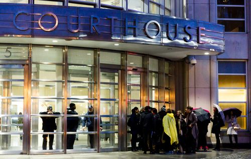 People wait in line to enter the United States District Court for the Eastern District of New York where the trial of Joaquin 'El Chapo' Guzman begins today. 