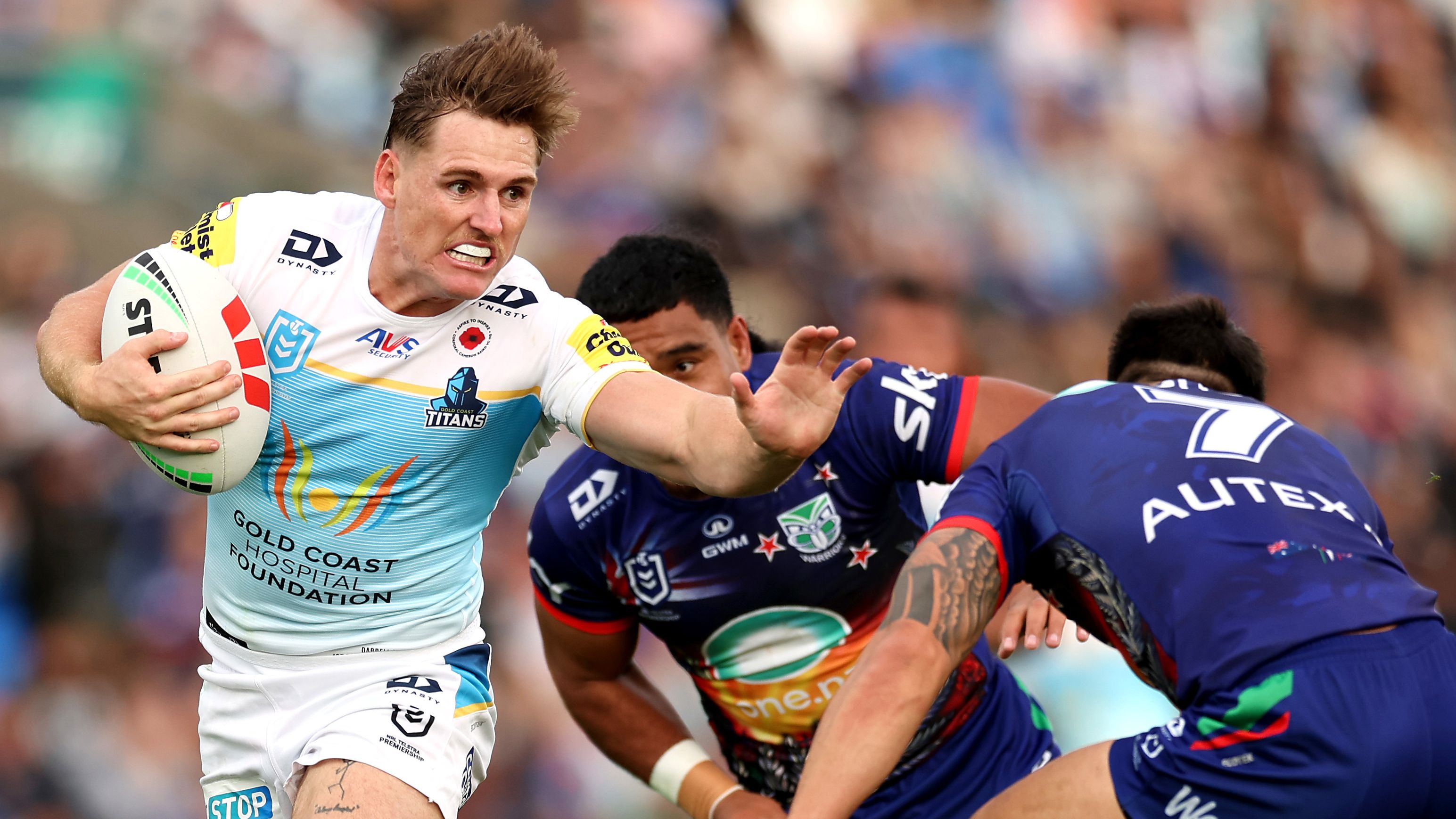 AJ Brimson is tackled during the round eight NRL match between the Warriors and the Gold Coast Titans.