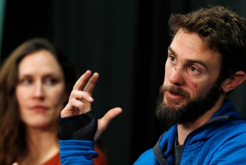 Travis Kauffman, right, with his girlfriend, Annie Bierbower, as they respond to questions during a news conference in Colorado.