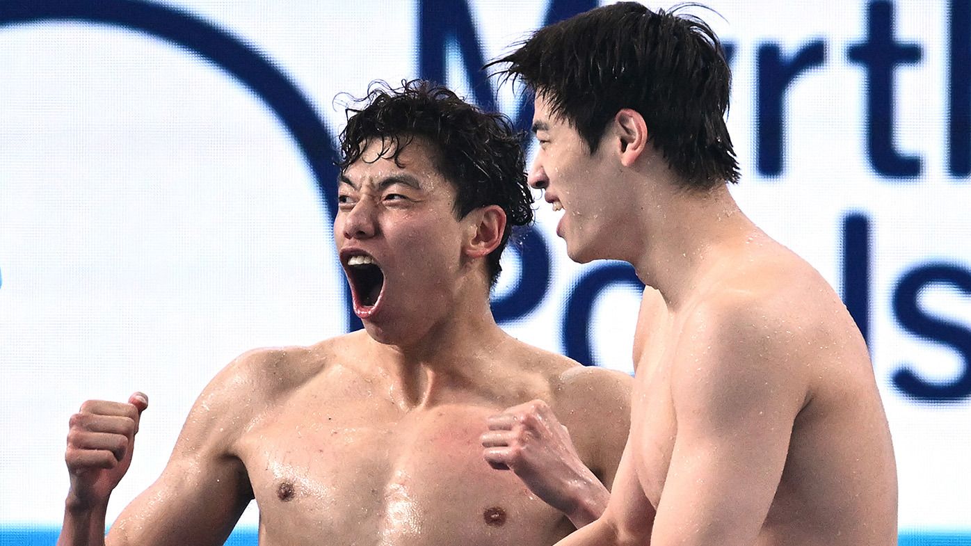 Xinjie Ji and Zhanle Pan of Team People&#x27;s Republic of China celebrate during the Men&#x27;s 4x100m Freestyle Final on day ten of the Doha 2024 World Aquatics Championships at Aspire Dome on February 11, 2024 in Doha, Qatar. (Photo by Quinn Rooney/Getty Images)