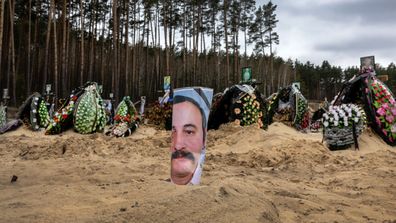  A portrait of Sylenko Valerii adorns a simple grave in a cemetery on April 20, 2022 in Irpin, Ukraine. At least 700 murdered civilians were found in towns around Kiev, following the Russian invasion, according to Ukrainian authorities. 