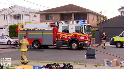 A man ﻿is fighting for life after he was allegedly stabbed in the chest and locked on the balcony of his Brisbane home, which was then set alight,Neighbours and a jogger who was passing the house in Grange in the city's north about 5.20am managed to pull Roberto Zumbo, 43, from the balcony before emergency services arrived.
Pierina Daidone-Zumbo, 44, who is believed to be the man's long-term partner, then allegedly set ﻿fire to items inside the house, including books and clothes.