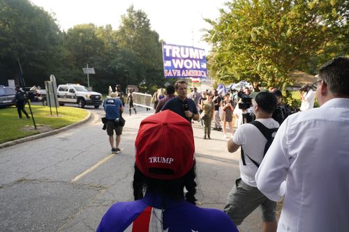 Former President Donald Trump's supporters gather outside of the Fulton County Jail, Thursday, Aug. 24, 2023, in Atlanta 