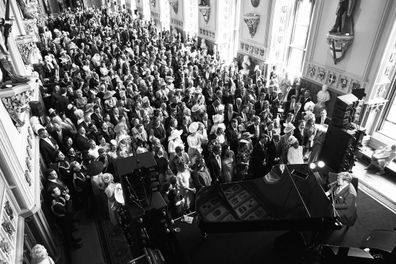 Elton John performs during the day at the wedding reception of Meghan, Duchess of Sussex, and Prince Harry, Duke of Sussex, at Windsor Castle on May 19, 2018 in Windsor.