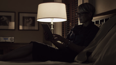 We get a glimpse of a more relaxed Claire working in bed with chic glasses and a steely resolve.