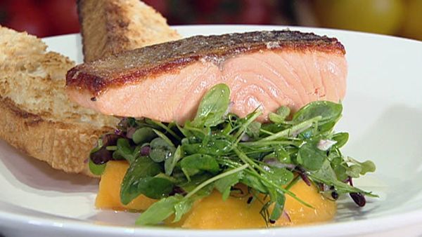 Crispy skinned salmon fillet with baby herbs