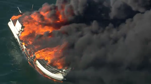 A boat is on fire in Port Phillip﻿, south of Melbourne's city centre, sending plumes of black smoke into the sky.