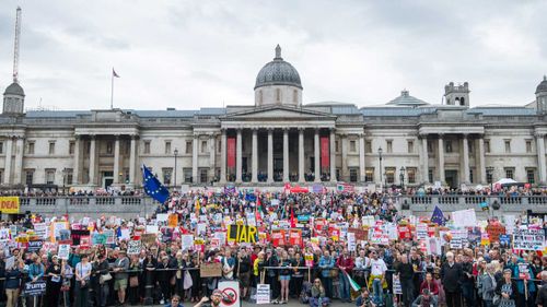 Anti-Trump protesters pack Trafalgar Square in London.