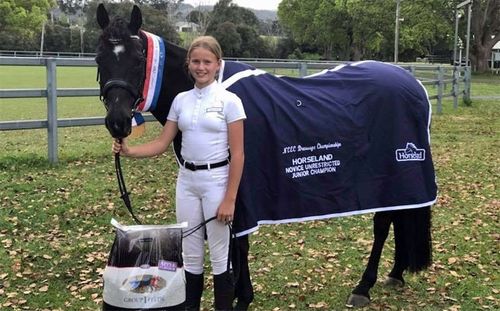 Lauren Grocott, pictured with her horse Liquorice, who appeared to be trying to protect her as it fell.