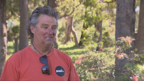 A man has shared how he managed to escape a suspected great white shark, which had knocked him into the water at a popular beach in Western Australia. ï»¿