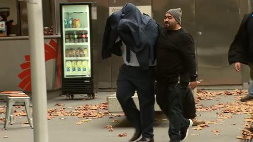 Hassan Abdallah walked into court with the assistance of another man. (9NEWS)