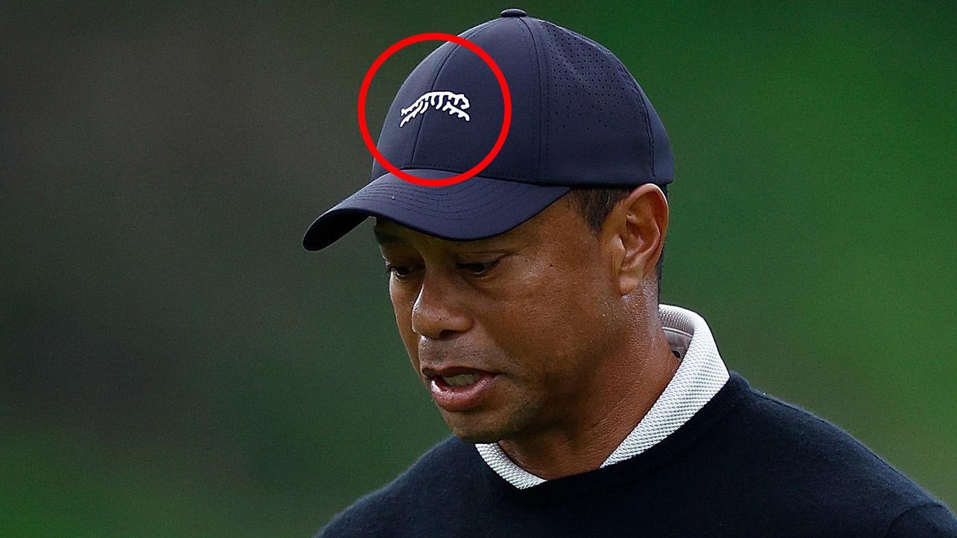 Tiger Woods red circle around his Sun Day Red logo.