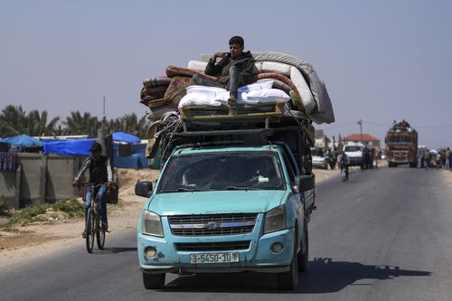 Displaced Palestinians arrive in central Gaza after fleeing from the southern Gaza city of Rafah in Deir al Balah, Gaza Strip, on Thursday, May 9, 2024