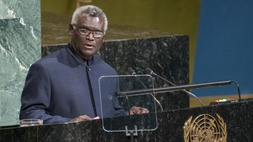 FILE - Manasseh Sogavare, Prime Minister of Solomon Islands, addresses the United Nations General Assembly, Friday, Sept. 22, 2017, at U.N. headquarters. Solomon Islands Prime Minister Sogavare has blamed foreign interference over his government's decision to switch alliances from Taiwan to Beijing for anti-government protests, arson and looting that have ravaged the capital in recent days. (AP Photo/Craig Ruttle, File)