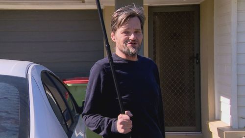 The 57-year-old chased the intruders out of his Redbank Plains home with his cane.