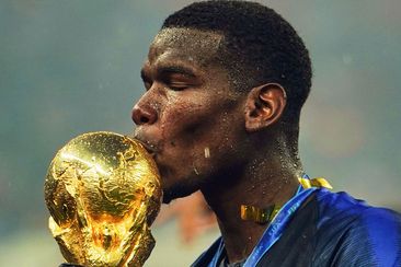 Paul Pogba kisses the World Cup.