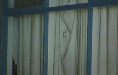 A bullet pierced through the front window of the property. Picture: 9NEWS