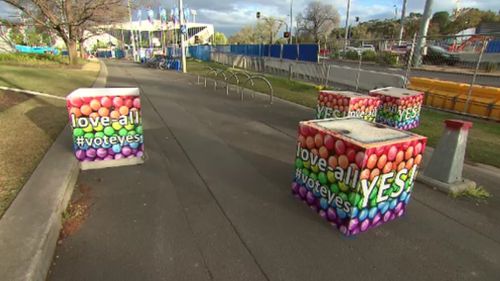 The posters were emblazoned with "voteyes" messages". (9NEWS)