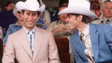 Prince Charles, Prince of Wales (left) and Prince Andrew, Duke of York (right) dress as cowboys on March 1, 1977 at Calgary in Canada